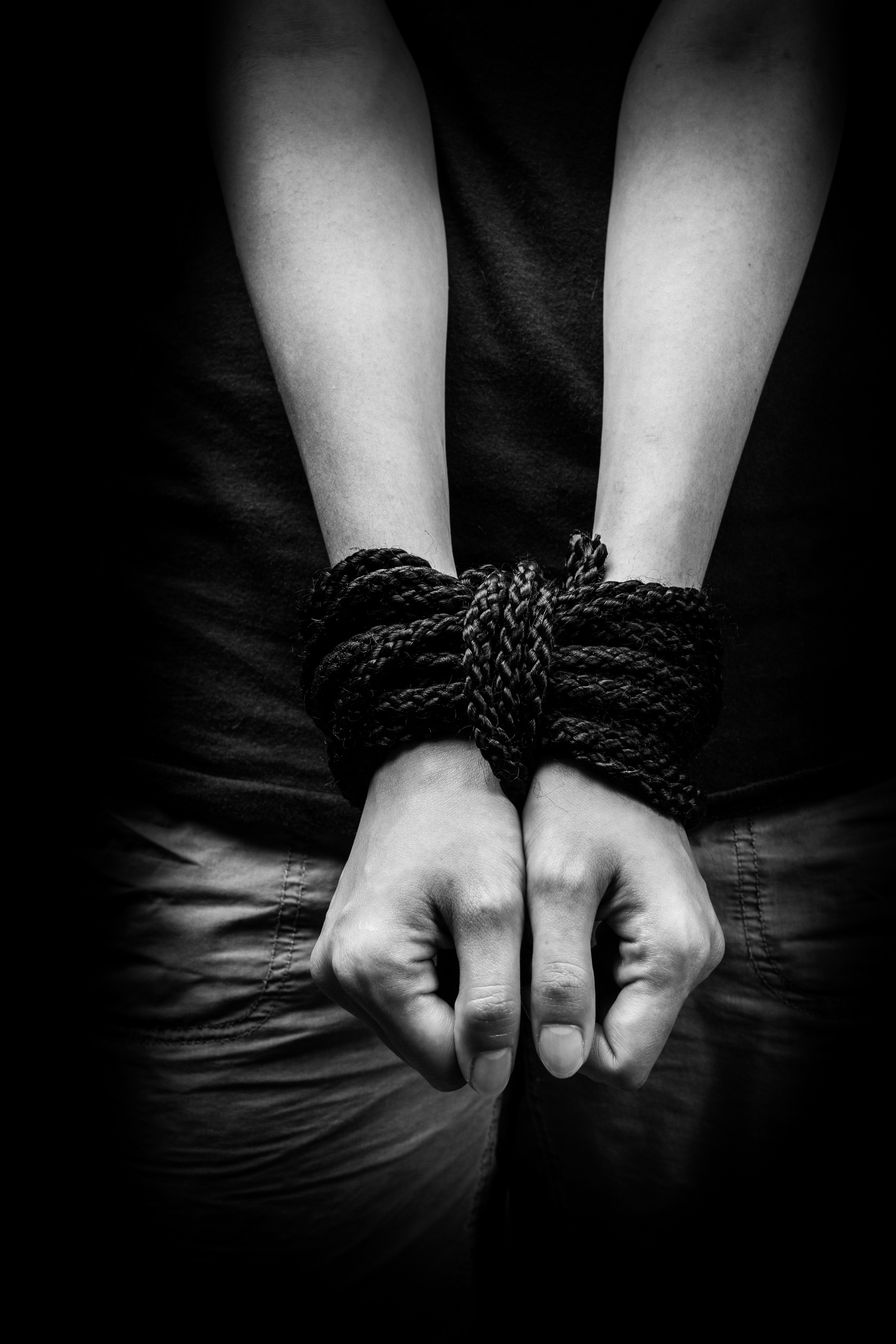 human hands tied with rope
